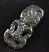 A Maori carved green nephrite Tiki pendant, 5.5in.