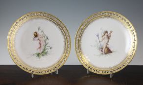A pair of Minton `Cherub` plate, painted by Antonin Boullemier, date code for 1874, the first with a