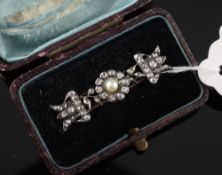 An Edwardian Art Nouveau gold and silver, diamond and split pearl set bar brooch, with stylised
