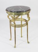 A late 19th century French circular brass gueridon, with inset marble top, winged caryatid