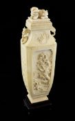 A Chinese ivory vase and cover, late 19th century, of rectangular baluster form, carved in high
