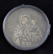 A 17th / 18th century Russian circular needlework religious icon, with raised silver threads, within