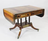 A Regency rosewood and brass inlaid sofa table, with two drawers opposing two dummy drawers, on four