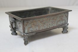 A Chinese archaistic bronze rectangular censer, cast in relief with taotie masks and scrolls, on