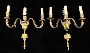 A set of five neo-classical three branch wall lights, modelled as an urn issuing three scrolling