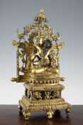 A large Tibetan gilt bronze group of Vajrasattva and his consort in Yab-Yum, 18th / 19th century, he
