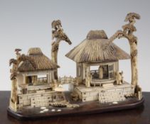 An unusual Japanese bone and ivory model of traditional Japanese thatched houses, late 19th /
