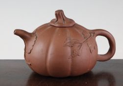 A Chinese Yixing pottery pumpkin shaped teapot and cover, 18cm.