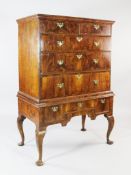 An 18th century walnut chest on stand fitted two drawers over three graduated drawers, on a stand