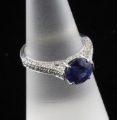 An 18ct white gold, solitaire tanzanite and diamond dress ring, with insurance schedule dated 14/