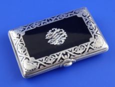 An early 20th century continental silver inlaid and mounted tortoiseshell aide memoire, of rounded
