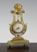 An early 20th century French ormolu and champleve enamel desk timepiece, of lyre form, with floral