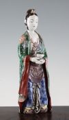 A Japanese Kutani porcelain figure of a Buddhist deity, late 19th century, standing and holding an