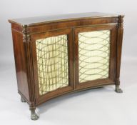 A Regency rosewood and brass inlaid concave side cabinet, fitted a pair of brass grille and