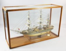 A large cased model of the Italian tall ship, Amerigo Vespucci, with laminated hull, three masts and