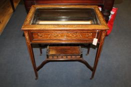 An Edwardian rectangular rosewood and marquetry inlaid bijouterie table, the lid with bevelled glass