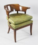 A French Empire mahogany elbow chair, attributed to Georges Jacob, with curved top rail, leather