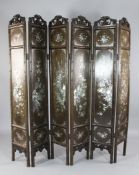 An early 20th century Chinese rosewood six fold screen, with mother of pearl and abalone inlaid