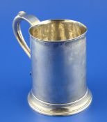 A George III provincial silver mug, of tapering form with scroll handle, maker`s mark rubbed,
