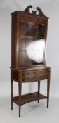An Edwardian Edwards and Roberts mahogany and marquetry inlaid display cabinet, with broken swan