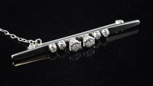An 18ct white gold and diamond tie pin, mounted with six illusion set diamonds and safety chain,