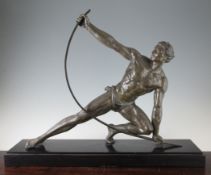 Attributed to Jean De Roncourt. A French Art Deco patinated metal model of a male figure bending a