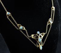 An Edwardian Art Nouveau 15ct gold and white opal pendant necklace, with five planished stylised