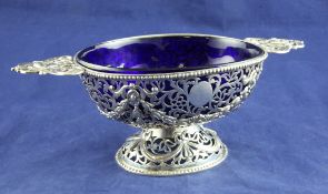 A Victorian pierced silver two handled oval pedestal bowl by Charles Thomas Fox & George Fox, with