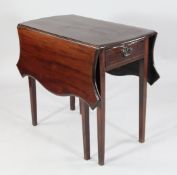 A George III mahogany butterfly Pembroke table, with shaped drop leaves and single end drawer on
