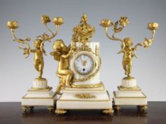 An early 20th century French ormolu mounted white marble clock garniture, the clock modelled with