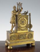 A French Empire ormolu mantel timepiece, surmounted with a figure of a classical lyre player