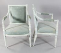 A pair of George III Adam style open armchairs, now painted white, with reeded back and arms,