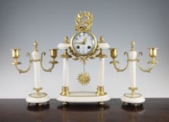 An early 20th century French gilt metal mounted white marble clock garniture, comprising a portico