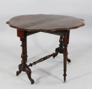 A Victorian walnut serpentine Sutherland table, with vase turned end supports and carved downswept