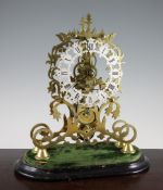 A Victorian brass skeleton clock, with silvered Roman dial and single fusee movement, on an ebonised