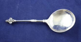 An early 18th century Swedish silver spoon, with tapering stem and mask finial, the bowl back with