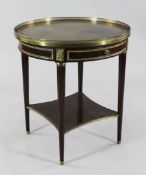 A French circular mahogany and gilt brass mounted centre table, the green leather and gilt tooled