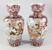 A pair of large Japanese Imari baluster vases, early 20th century, each painted with scenes of