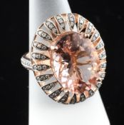 A modern 14ct gold, morganite and diamond set oval dress ring, with AIG estimated retail and