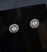 A pair of white gold and diamond set target earrings, with a total diamond weight of 1.32ct.
