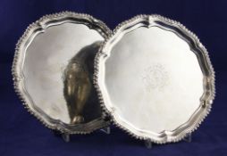 A pair of George III Irish silver salvers, of shaped circular form, with later engraved armorials