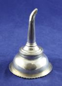 A matched George III silver wine funnel, with gadrooned border and shaped thumbpiece, top possibly