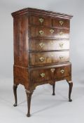 An early 18th century walnut chest on stand, fitted two short over three long drawers, on a stand