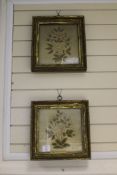 Two gilt framed needlework panels, depicting stitched flowers on a silk background, largest 12in.