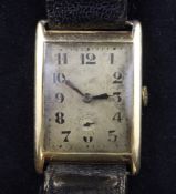 A gentleman`s 1930`s Swiss 18ct gold manual wind wrist watch, with rectangular Arabic dial and