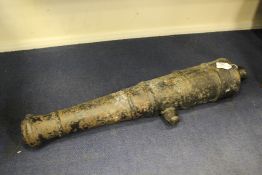 An early 19th century cast iron cannon, with remains of black paint, 33in.