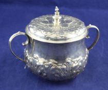A late 17th/early 18th century American? silver two handled caudle cup and cover of baluster form,