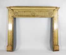 A George III carved pine fire surround, of architectural form, with acanthus leaf frieze over