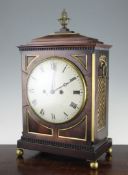 A Regency brass mounted mahogany mantel clock, with painted Roman dial and unsigned twin fusee