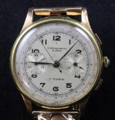 A 1940`s/50`s Swiss 18ct gold chronograph wrist watch, with Arabic numerals and two subsidiary